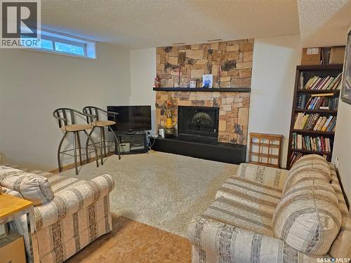 314 Milden Street, Conquest, SK - Indoor Photo Showing Living Room With Fireplace