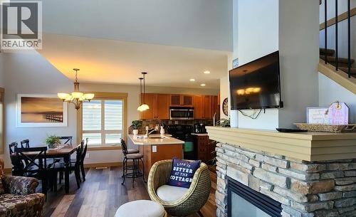 6844 Madrid Way Unit# 321, Fintry, BC - Indoor With Fireplace