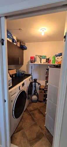 Salle de lavage - 401-3330 Boul. Le Carrefour, Laval (Chomedey), QC - Indoor Photo Showing Laundry Room