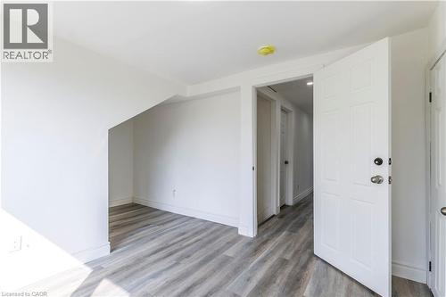 Bonus room featuring light wood finished floors and baseboards - 1411 E 56 Highway, Glanbrook, ON - Indoor Photo Showing Other Room