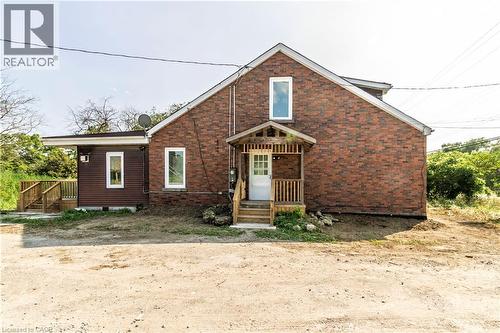 View of front of home featuring brick siding - 1411 E 56 Highway, Glanbrook, ON - Outdoor With Exterior
