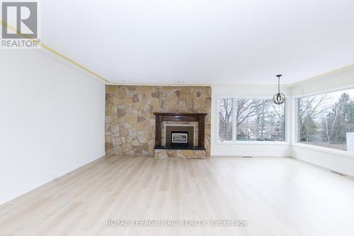 LR with a sitting area overlooking the view. - 61 Tremont Drive, St. Catharines (Glendale/Glenridge), ON - Indoor Photo Showing Living Room With Fireplace