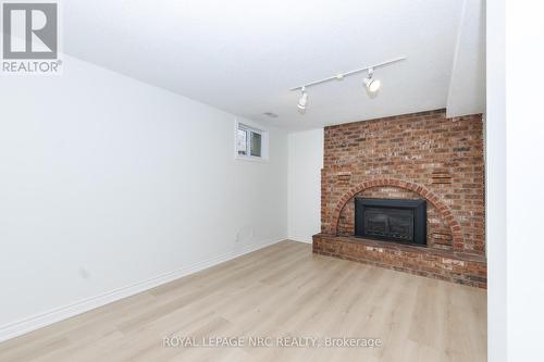 Basement bedroom1 - 61 Tremont Drive, St. Catharines (Glendale/Glenridge), ON - Indoor Photo Showing Living Room With Fireplace