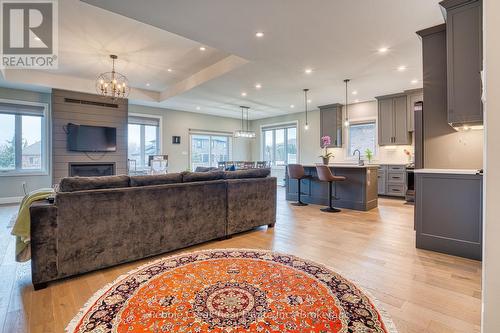 open concept living room/kitchen - 182 Shearwater Trail, Goderich (Goderich (Town)), ON - Indoor With Fireplace
