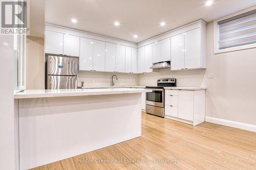 kitchen in basement with lots of storage - 182 Shearwater Trail, Goderich (Goderich (Town)), ON - Indoor Photo Showing Kitchen