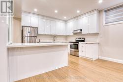 kitchen in basement with lots of storage - 