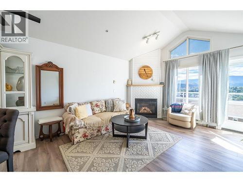 3320 Centennial Drive Unit# 403, Vernon, BC - Indoor Photo Showing Living Room With Fireplace