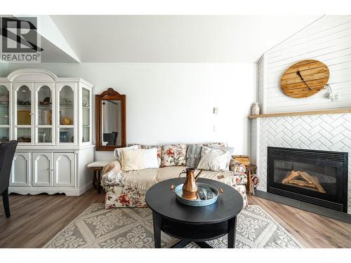 3320 Centennial Drive Unit# 403, Vernon, BC - Indoor Photo Showing Living Room With Fireplace