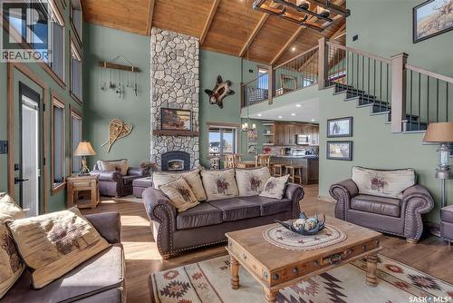 35 Grace Bay, Diefenbaker Lake, SK - Indoor Photo Showing Living Room With Fireplace