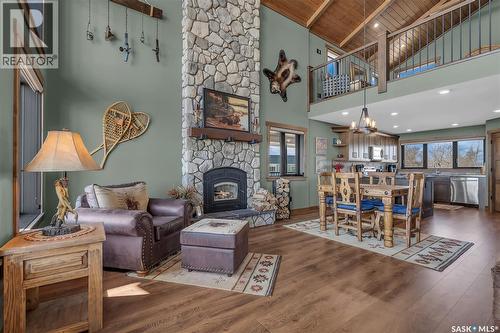 35 Grace Bay, Diefenbaker Lake, SK - Indoor Photo Showing Living Room With Fireplace
