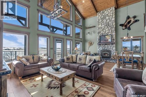 35 Grace Bay, Diefenbaker Lake, SK - Indoor Photo Showing Living Room With Fireplace