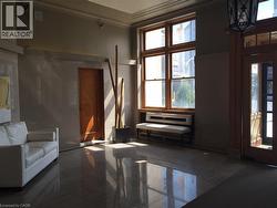 Living area featuring ornamental molding and plenty of natural light - 