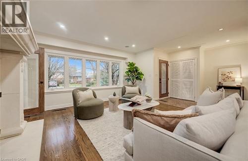Living area with hardwood / wood-style flooring, crown molding, and recessed lighting - 655 Ellengale Road, Burlington, ON - Indoor Photo Showing Living Room