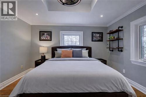 Bedroom with dark wood-style floors, crown molding, and recessed lighting - 655 Ellengale Road, Burlington, ON - Indoor Photo Showing Bedroom