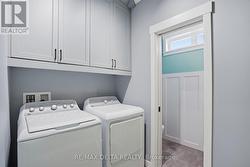 Laundry area, powder room to left. - 