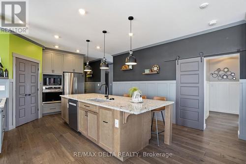 Sliding door leads to nanny suite. - 100 Pendleton Street, Champlain, ON - Indoor Photo Showing Kitchen With Upgraded Kitchen