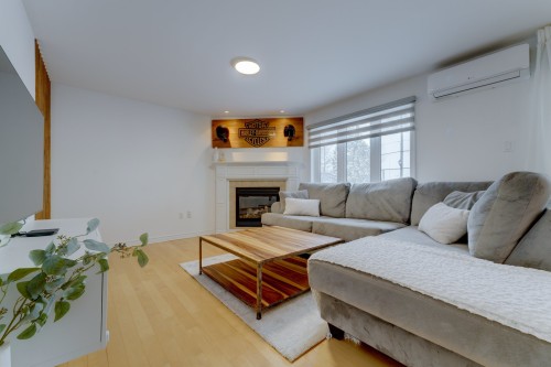 Salon - 107 Rue Louise-Bernard, Beloeil, QC - Indoor Photo Showing Living Room With Fireplace