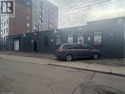 View of building exterior featuring uncovered parking - 