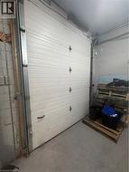 Garage featuring concrete block wall - 