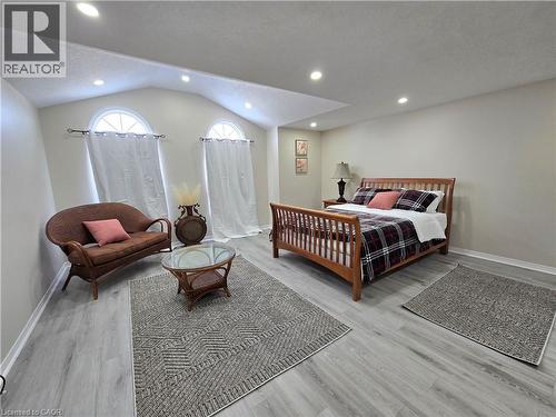 Bedroom with light wood-style floors, recessed lighting, and a textured ceiling - 59 Highgate Road Unit# 1, Kitchener, ON - Indoor Photo Showing Bedroom