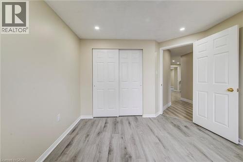 Unfurnished bedroom featuring light wood finished floors, recessed lighting, and a closet - 59 Highgate Road Unit# 1, Kitchener, ON - Indoor Photo Showing Other Room