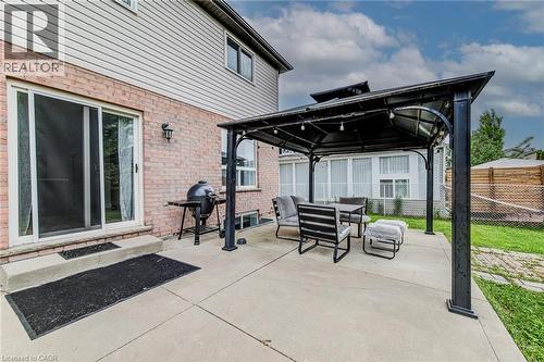 View of patio with a gazebo, area for grilling, and outdoor dining area - 59 Highgate Road Unit# 1, Kitchener, ON - Outdoor With Exterior