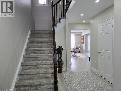 Staircase with wood finished floors and recessed lighting - 59 Highgate Road Unit# 1, Kitchener, ON - Indoor Photo Showing Other Room