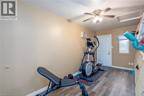 Workout room with ceiling fan and wood finished floors - 1278 Consort Crescent, Burlington, ON - Indoor Photo Showing Gym Room