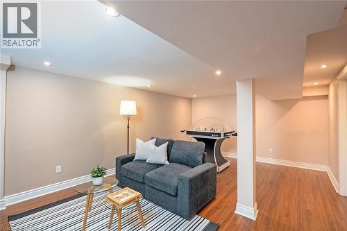 Living room featuring wood finished floors and recessed lighting - 1278 Consort Crescent, Burlington, ON - Indoor