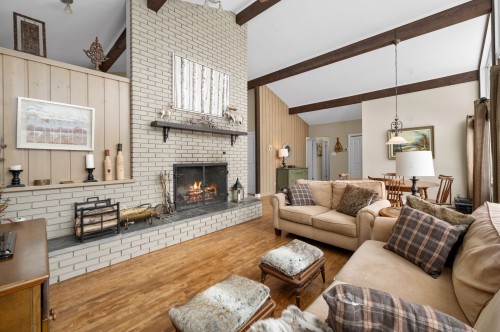 Salon - 1 Av. De Champfleury, Estérel, QC - Indoor Photo Showing Living Room With Fireplace