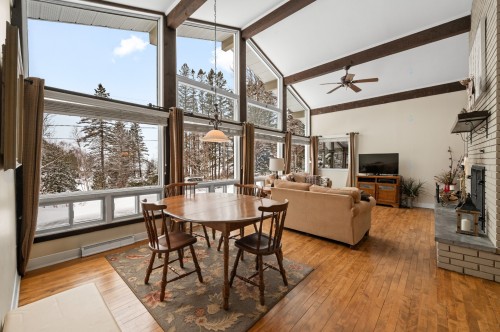 Vue d'ensemble - 1 Av. De Champfleury, Estérel, QC - Indoor With Fireplace