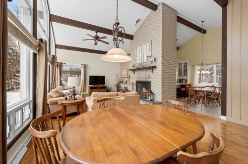 Salle à manger - 1 Av. De Champfleury, Estérel, QC - Indoor Photo Showing Dining Room With Fireplace