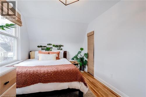 Bedroom with light wood-style flooring and vaulted ceiling - 624 Burgess Avenue, Hamilton, ON - Indoor Photo Showing Bedroom