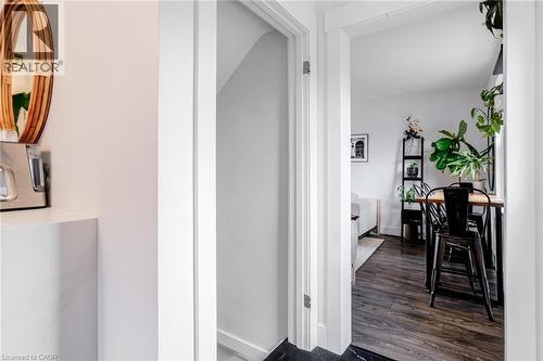Hall with dark wood finished floors and baseboards - 624 Burgess Avenue, Hamilton, ON - Indoor