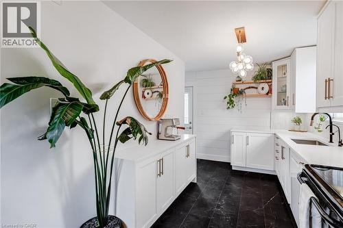 Kitchen featuring white cabinets, glass fronted cabinets, and open shelves - 624 Burgess Avenue, Hamilton, ON - Indoor Photo Showing Kitchen With Upgraded Kitchen