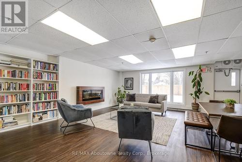 Meeting room with Library - 401 - 212 Kerr Street, Oakville (Co Central), ON - Indoor With Fireplace