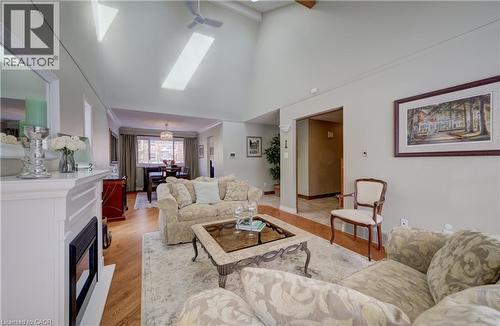 Large bay window, hardwood floors and gas fireplace in the living room. - 54 Glenwood Drive, Kitchener, ON - Indoor Photo Showing Living Room
