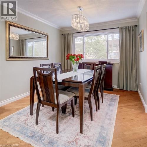Crown molding and hardwood in the dining area. - 54 Glenwood Drive, Kitchener, ON - Indoor Photo Showing Dining Room