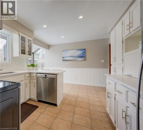 Stainless steel appliances are included. New quartz countertops as well. - 54 Glenwood Drive, Kitchener, ON - Indoor Photo Showing Kitchen With Double Sink
