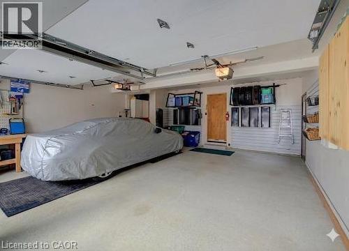 Main floor laundry room with lots of storage in the cabinets and closet. - 54 Glenwood Drive, Kitchener, ON - Indoor Photo Showing Laundry Room