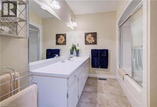 Oak feature wall and oak ceiling and fireplace give the rec room a cozy feel. - 54 Glenwood Drive, Kitchener, ON - Indoor