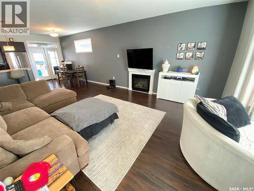 703 Barber Crescent, Weyburn, SK - Indoor Photo Showing Living Room With Fireplace