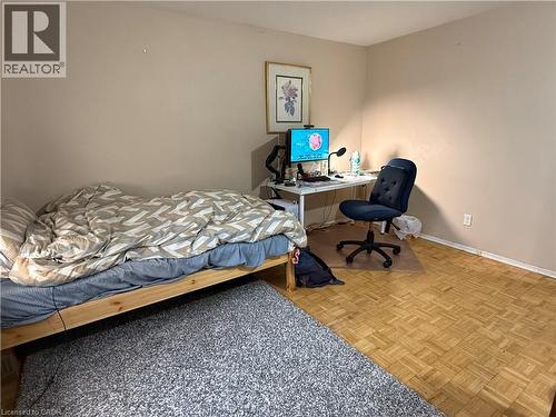 Bedroom with parquet floors and an office area - 60 Helene Crescent, Waterloo, ON - Indoor Photo Showing Bedroom