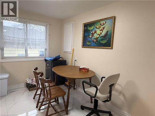 Dining area featuring light marble finish floors - 60 Helene Crescent, Waterloo, ON - Indoor Photo Showing Dining Room