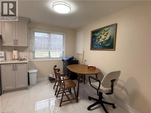 Dining area with baseboards and light marble finish floors - 60 Helene Crescent, Waterloo, ON - Indoor Photo Showing Other Room