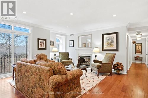 305 - 390 Upper Middle Road E, Oakville, ON - Indoor Photo Showing Living Room With Fireplace