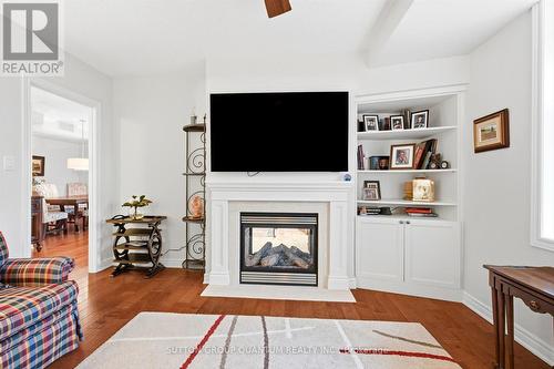 305 - 390 Upper Middle Road E, Oakville, ON - Indoor Photo Showing Living Room With Fireplace