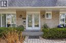 View of exterior entry featuring a porch, a shingled roof, and stone siding - 273 Bryant Crescent, Burlington, ON  - Outdoor 
