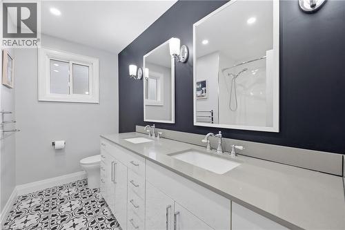 Bathroom featuring double vanity, a shower, light tile patterned floors, and recessed lighting - 273 Bryant Crescent, Burlington, ON - Indoor Photo Showing Bathroom