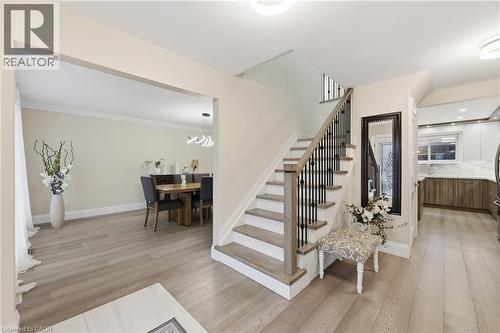 Stairway featuring wood finished floors and a chandelier - 273 Bryant Crescent, Burlington, ON - Indoor